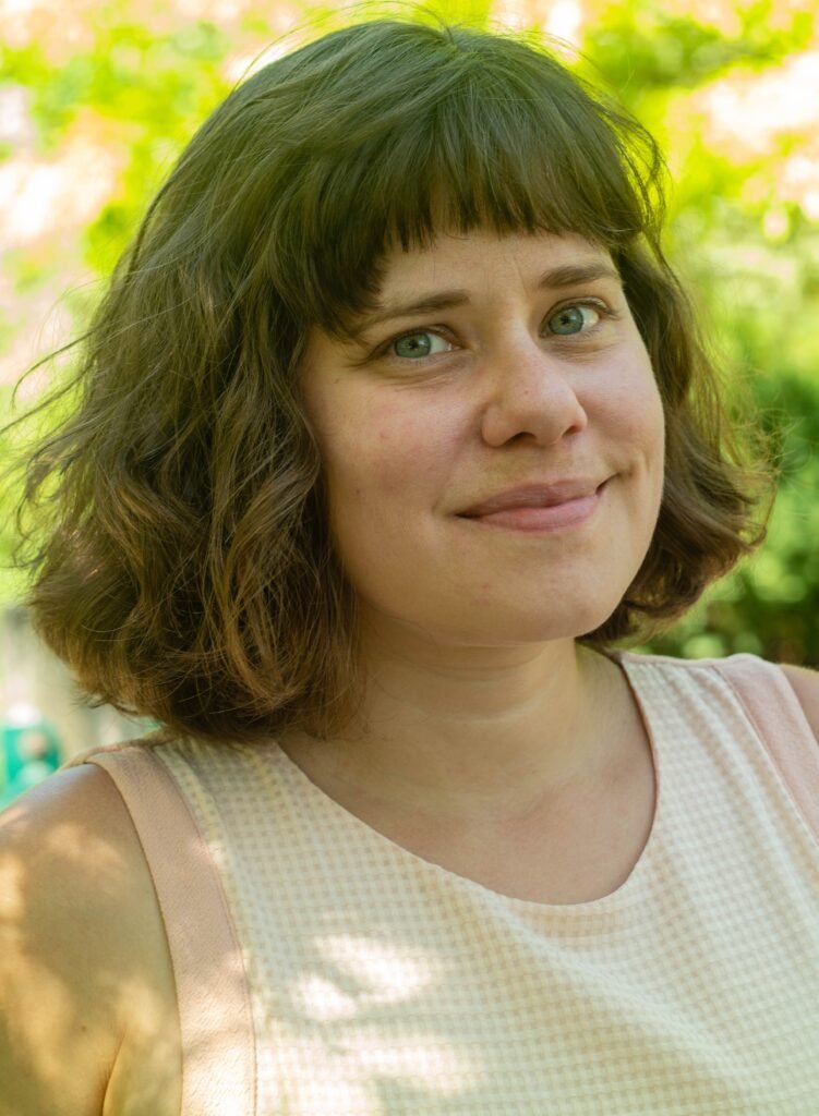 Headshot of a woman outside.